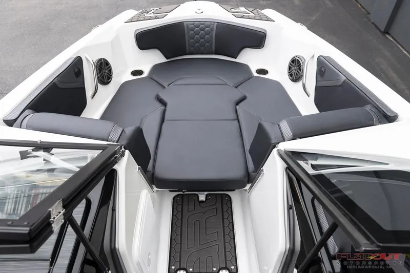 Slide: The Image of 2023 Scarab 215 ID boat interior with black seating and speakers. - 41