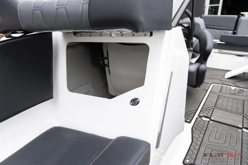 Slide: The Image of 2023 Scarab 215 ID boat interior seating and storage compartment. - 5