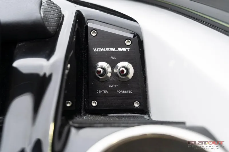 Slide: The Image of Control panel of 2023 Scarab 215 ID boat with WakeBlast system. - 9