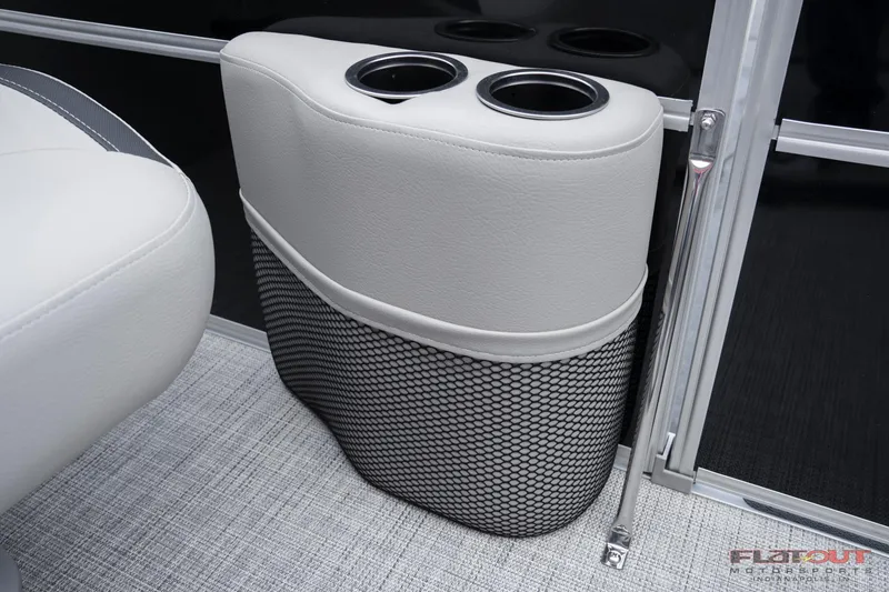Slide: The Image of 2023 South Bay 224RSLE275 boat cup holders and storage compartment. - 15