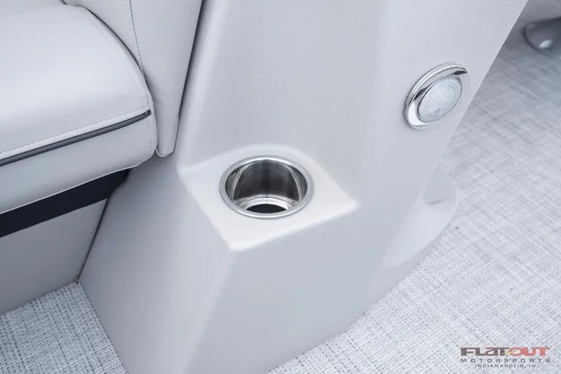 Slide: The Image of 2023 South Bay 224RSLE275 boat interior cup holder and seating detail. - 17