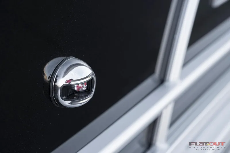 Slide: The Image of Close-up of 2023 South Bay 224RSLE275 boat's chrome handle and black panel. - 23