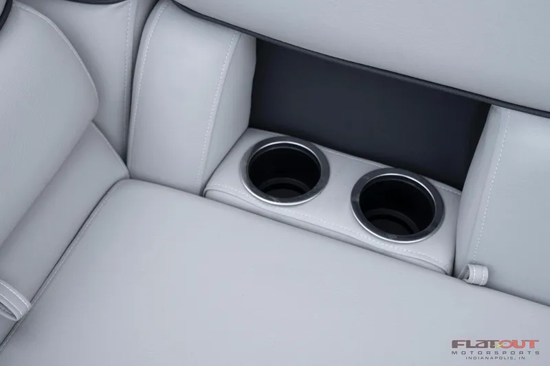 Slide: The Image of 2023 South Bay 224RSLE275 boat interior with dual cup holders. - 25