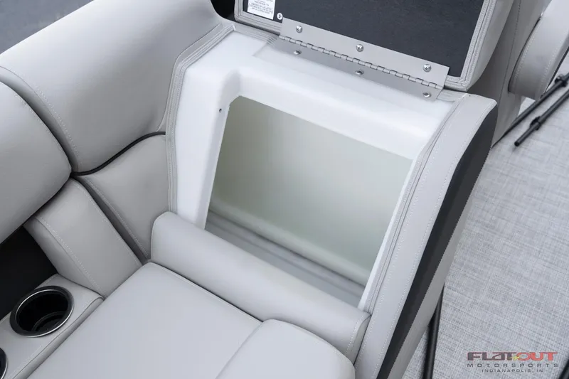 Slide: The Image of 2023 South Bay 224RSLE275 boat storage compartment with cup holders. - 4