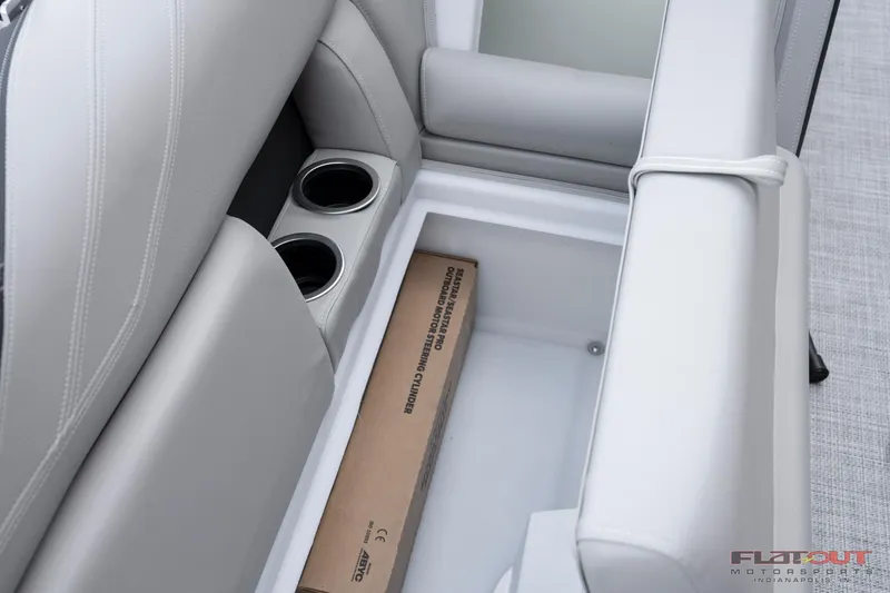 Slide: The Image of 2023 South Bay 224RSLE275 boat storage compartment with cup holders. - 5