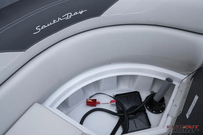 Slide: The Image of 2023 South Bay 224RSLE275 boat storage compartment with wiring and battery. - 7