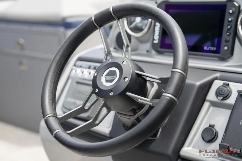Slide: The Image of Steering wheel and dashboard of 2023 South Bay 525 3.0 Entertain 200HP boat. - 11
