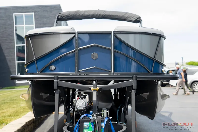 Slide: The Image of 2023 South Bay 525 3.0 Entertain 200HP pontoon boat on trailer, front view. - 16