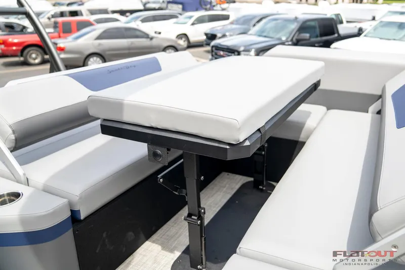 Slide: The Image of 2023 South Bay 525 3.0 Entertain 200HP boat interior with seating and table. - 26