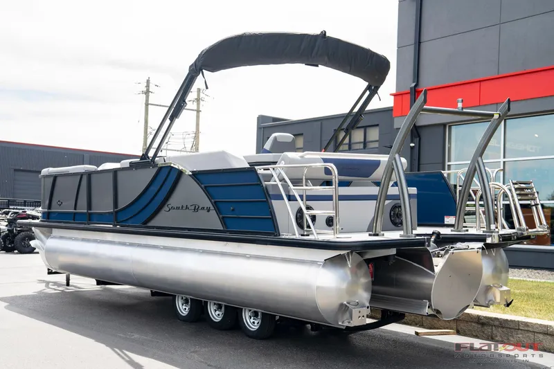 Slide: The Image of 2023 South Bay 525 3.0 Entertain 200HP pontoon boat on a trailer. - 5