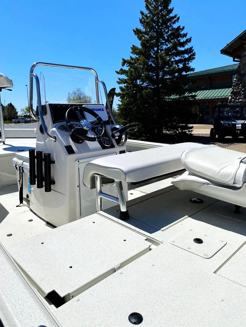 Slide: The Image of 2023 Ranger RB190 boat with sleek console and seating, set against a clear blue sky. - 3