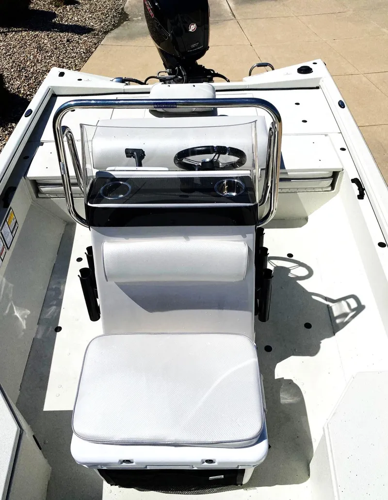 Slide: The Image of 2023 Ranger RB190 boat interior with steering console and seating. - 8