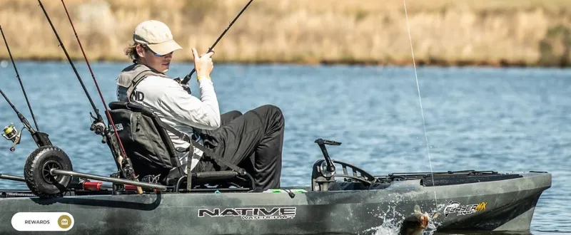 Slide: The Image of Man fishing on a 2023 Native Watercraft Propel 12.5 Max kayak in a lake. - 6