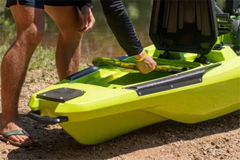 Slide: The Image of Person preparing Bonafide P127 kayak, 2023 model, on a gravel shore. - 6