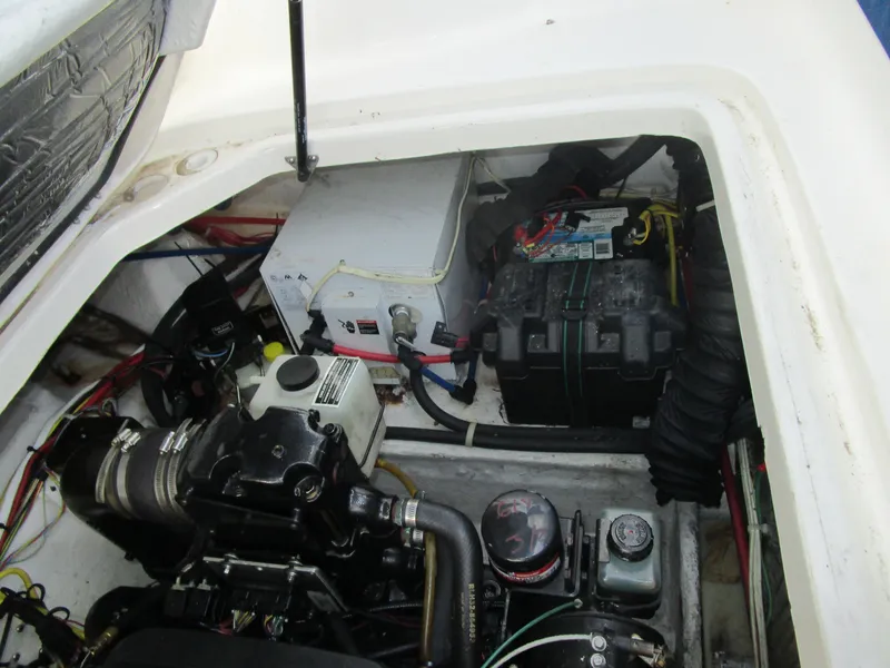 Slide: The Image of Engine compartment of a 2005 Bayliner 285 boat, showing battery and mechanical components. - 16