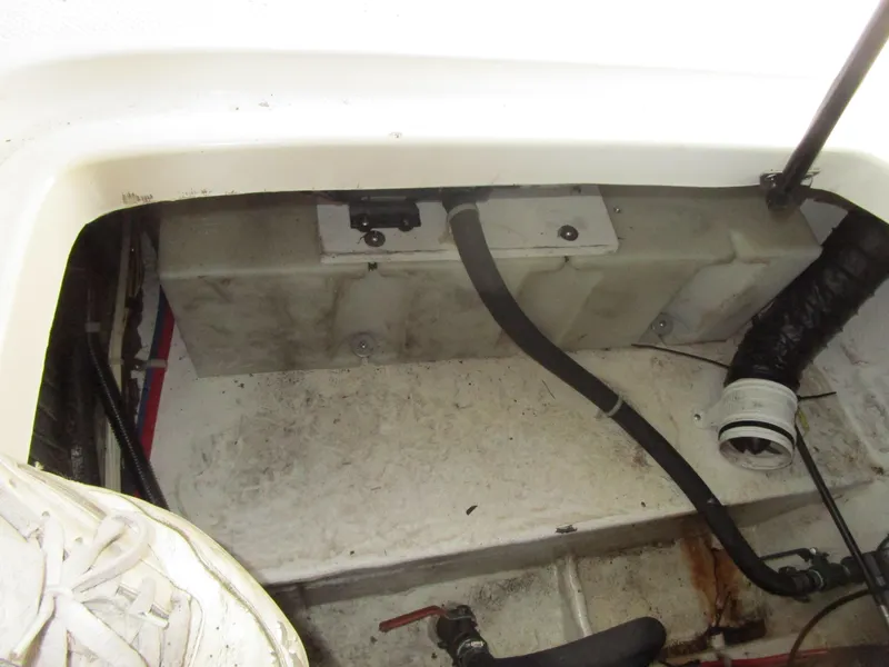 Slide: The Image of 2005 Bayliner 285 engine compartment with visible hoses and components. - 17