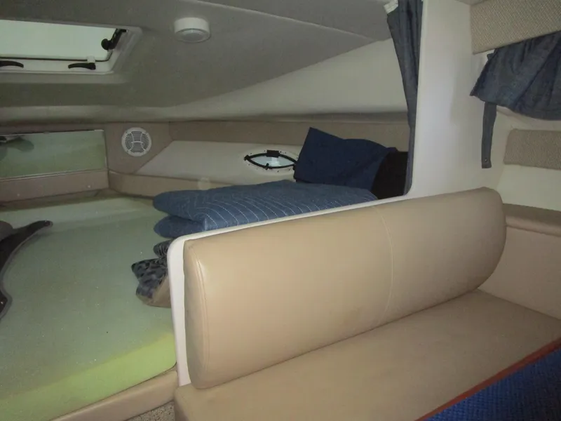 Slide: The Image of Interior cabin of 2005 Bayliner 285 boat with seating and bedding. - 38