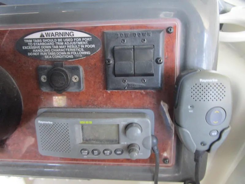 Slide: The Image of Control panel of a 2005 Bayliner 285 boat with warning label and radio equipment. - 9