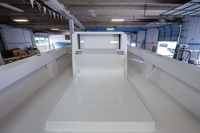 Slide: The Image of Close-up of 2023 Sparks 46 boat model in a warehouse. - 12