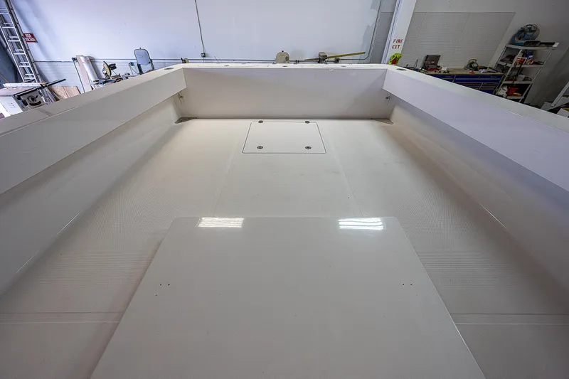 Slide: The Image of 2023 Sparks 46 boat interior in a warehouse. - 15