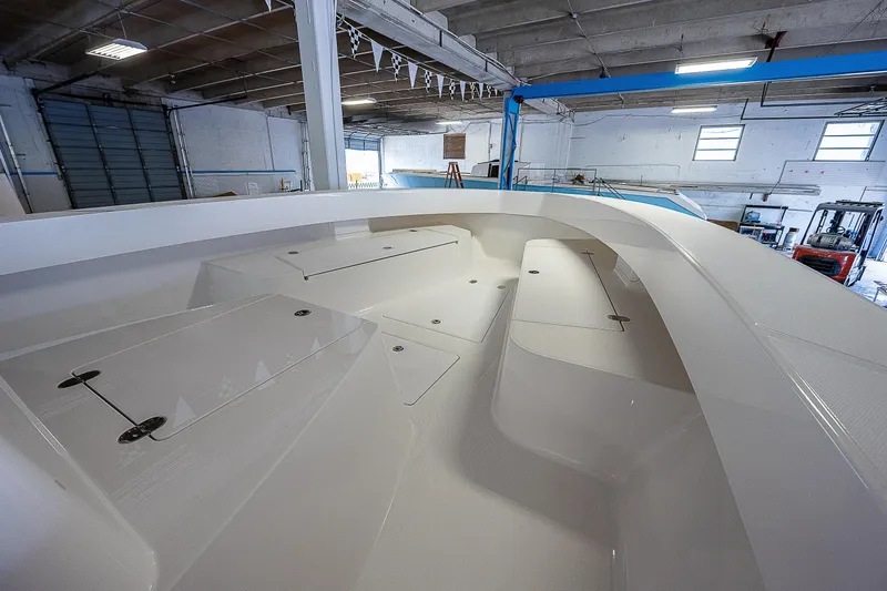 Slide: The Image of Interior view of 2023 Sparks 46 boat under construction in a workshop. - 16