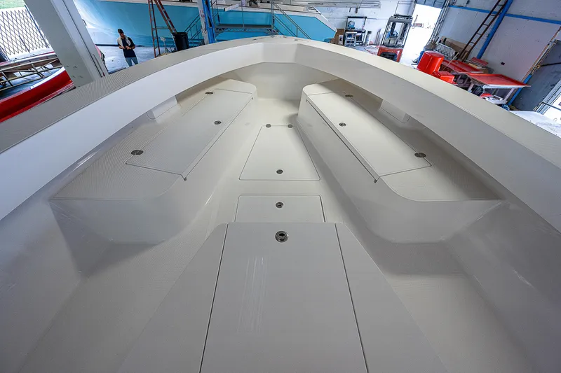 Slide: The Image of 2023 Sparks 46 boat interior in a warehouse, showcasing sleek design and spacious layout. - 17