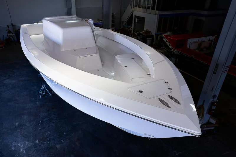 Slide: The Image of 2023 Sparks 46 boat interior with open storage compartment in a warehouse. - 24