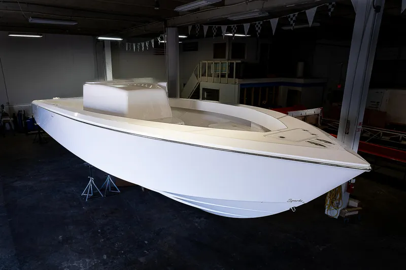Slide: The Image of 2023 Sparks 46 boat in a warehouse, side view. - 25