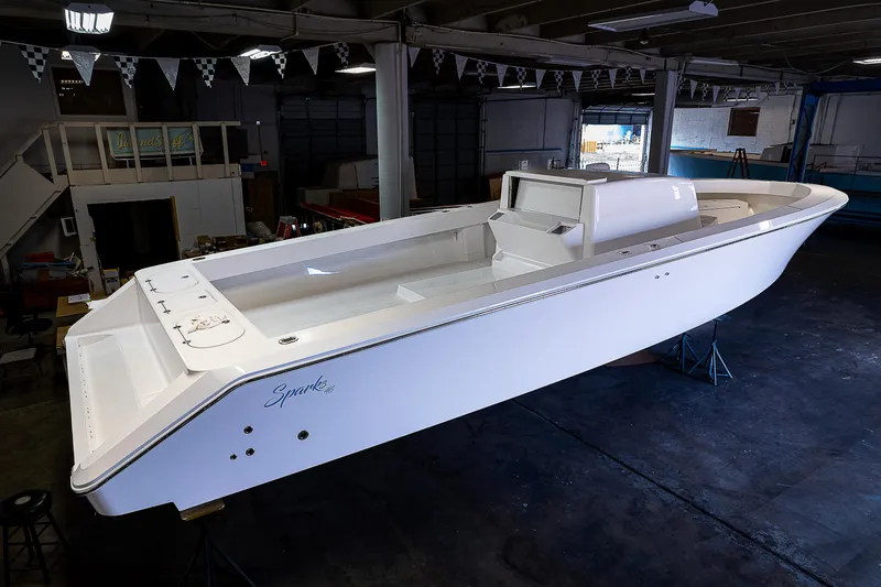 Slide: The Image of 2023 Sparks 46 boat in a workshop, top view. - 27