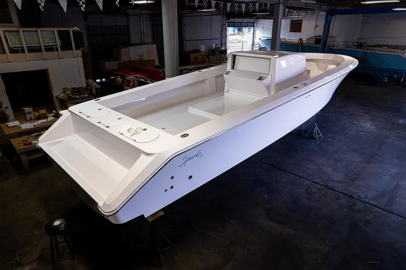 Slide: The Image of 2023 Sparks 46 boat in a workshop, top view. - 28