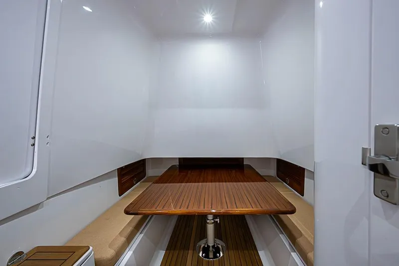 Slide: The Image of Interior of Sparks 46, 2026, featuring wooden table and benches. - 44