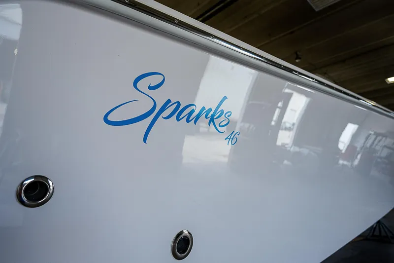 Slide: The Image of Close-up of 2023 Sparks 46 boat model in a warehouse. - 66