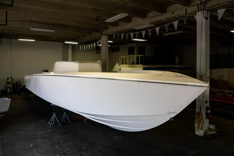 Slide: The Image of 2023 Sparks 46 boat in a warehouse, side view. - 79