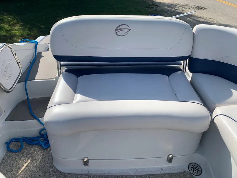 Slide: The Image of 2012 Crownline Eclipse E4 boat seating area with white and blue upholstery. - 10