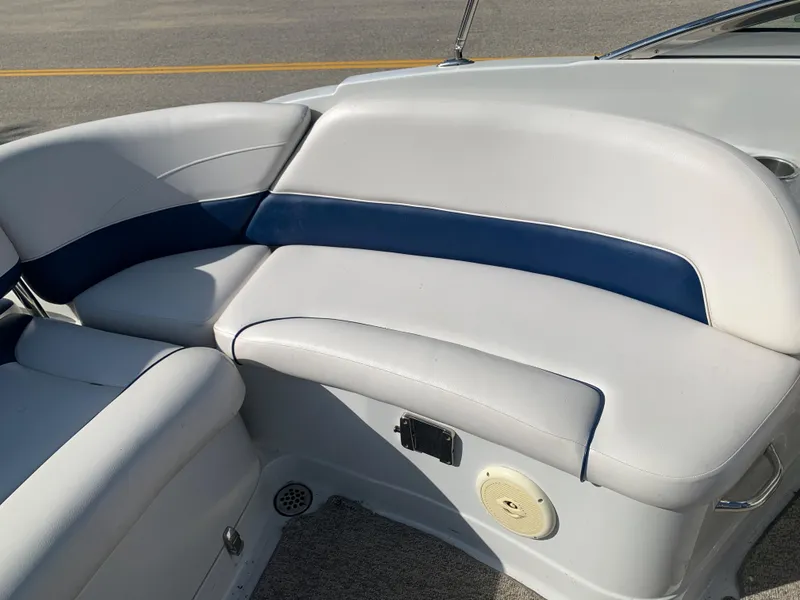 Slide: The Image of 2012 Crownline Eclipse E4 boat interior seating with blue and white upholstery. - 12