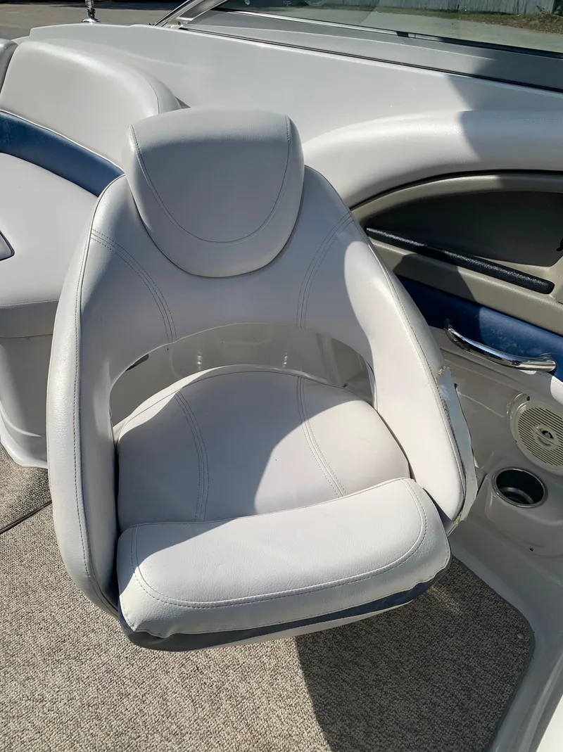Slide: The Image of 2012 Crownline Eclipse E4 boat interior with white captain's chair. - 17