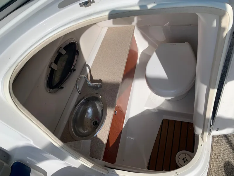 Slide: The Image of 2012 Crownline Eclipse E4 boat bathroom with sink and toilet. - 19