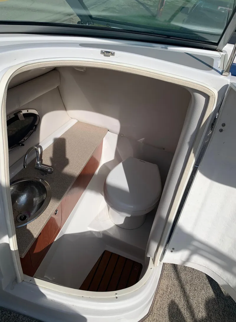 Slide: The Image of 2012 Crownline Eclipse E4 boat bathroom with sink and toilet. - 20
