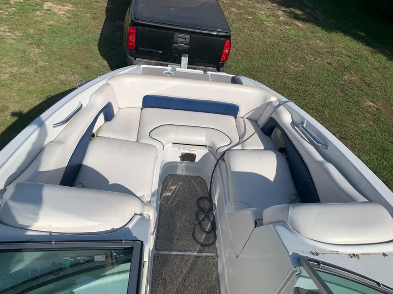 Slide: The Image of 2012 Crownline Eclipse E4 boat interior with white and blue seating. - 23