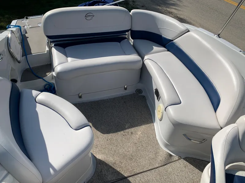 Slide: The Image of 2012 Crownline Eclipse E4 boat interior with white and blue seating. - 8