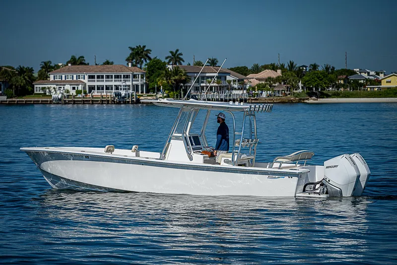 Slide: The Image of 2020 Birdsall 30 CC boat cruising on calm water near waterfront homes. - 14