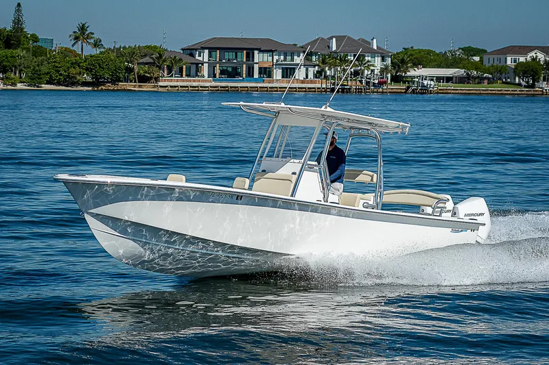 Slide: The Image of 2020 Birdsall 30 CC boat cruising on a sunny day near waterfront homes. - 17