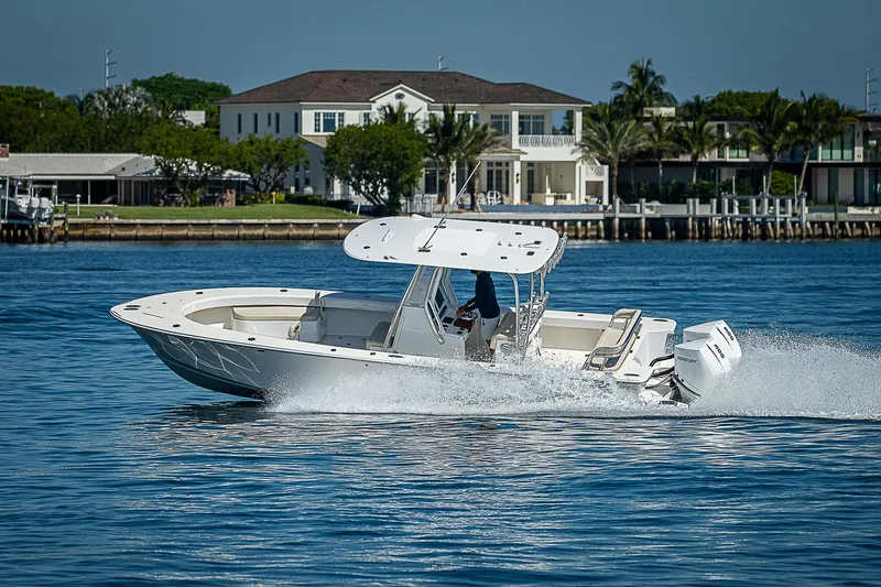 Slide: The Image of 2020 Birdsall 30 CC boat cruising on a sunny day near waterfront homes. - 21
