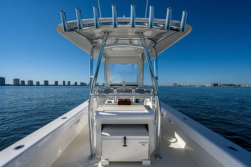 Slide: The Image of 2020 Birdsall 30 CC boat on calm water with city skyline in background. - 28