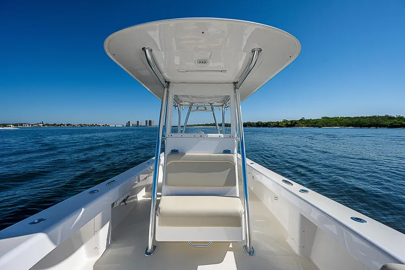 Slide: The Image of 2020 Birdsall 30 CC boat on open water, clear blue sky, and distant shoreline. - 4