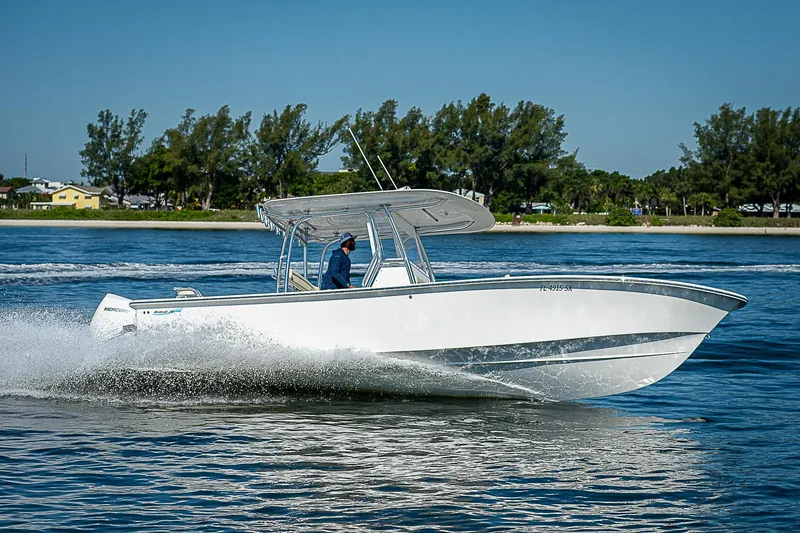 Slide: The Image of 2020 Birdsall 30 CC boat cruising on a sunny day, surrounded by calm waters. - 42