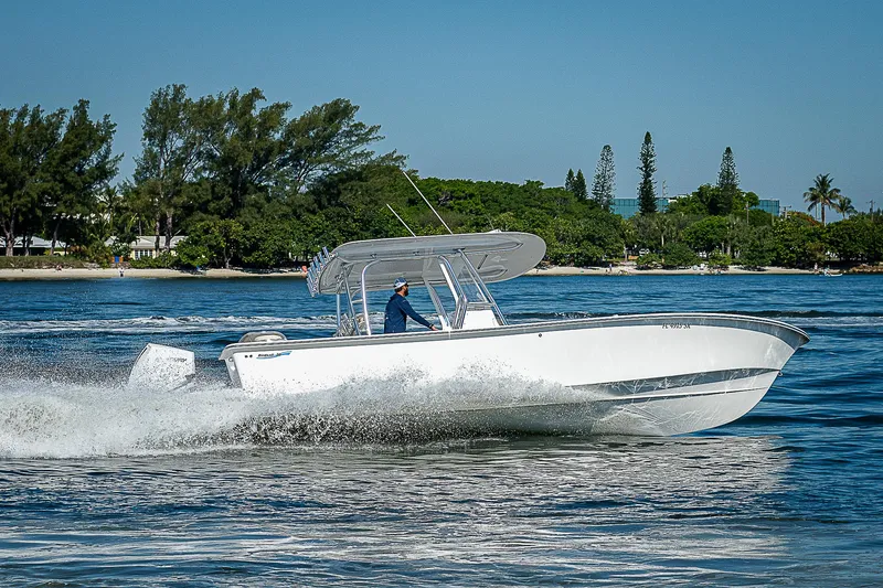 Slide: The Image of 2020 Birdsall 30 CC boat cruising on a sunny day with lush greenery in the background. - 43