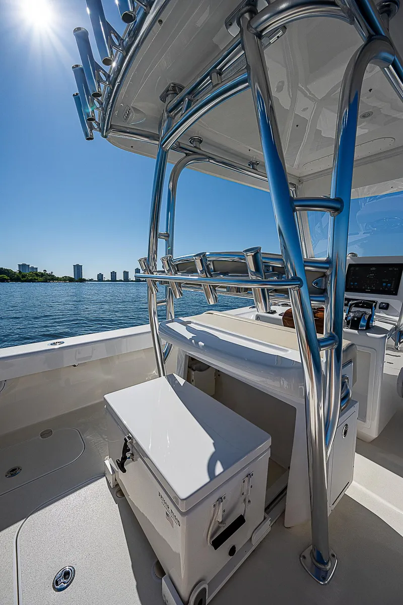 Slide: The Image of 2020 Birdsall 30 CC boat with sleek design, chrome details, and ocean backdrop. - 8