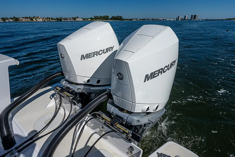 Slide: The Image of Twin Mercury outboard engines on a 2020 Birdsall 30 CC boat in open water. - 9