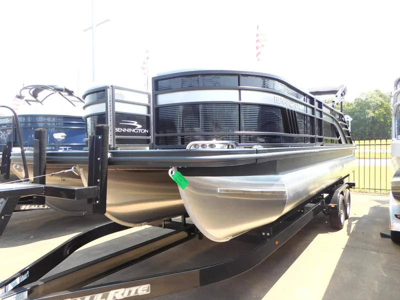 Slide: The Image of 2023 Bennington 24 LXSB pontoon boat on trailer. - 0
